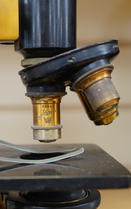 An early 20th century monocular brass microscope by W. Watson & Sons, 31cm high. Condition - fair to good.